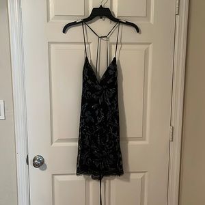 Lucy in the sky sequin on black short dress.